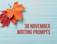 30 November Writing Prompts title against light blue background with two maple leaves in red and orange